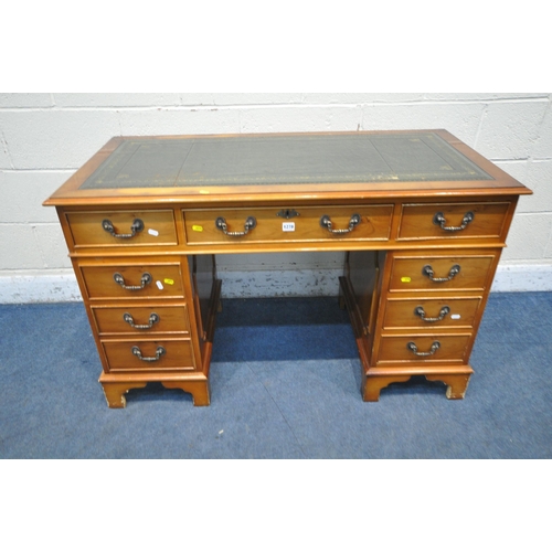 1198 - A 20TH CENTURY YEW WOOD TWIN PEDESTAL DESK, with a green tooled leather writing surface, fitted with... 