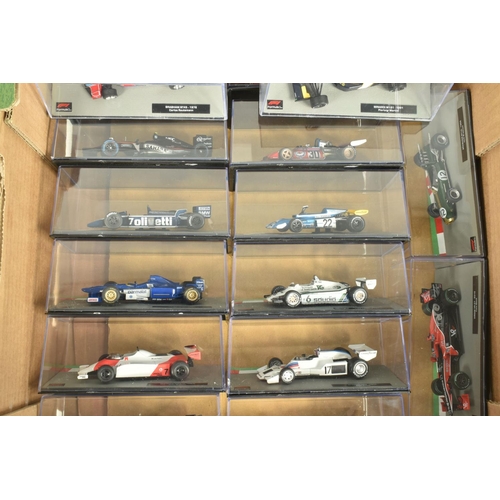 72 - TWO TRAYS OF DISPLAYED FORMULA 1 CARS AND MATCHING FORMULA 1 THE CAR COLLECTION MAGAZINES, an almost... 