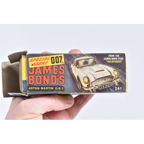 111 - A BOXED CORGI TOYS JAMES BOND ASTON MARTIN DB5, No.261, working features, very lightly playworn cond... 