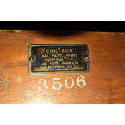 372 - A W4989A B34 MILITARY RADIO RECIEVER AND COIL CARTRIDGES, large unit with dark navy rear and near ro... 