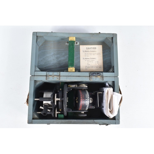 402 - A CASED MILITARY AEROPLANE BOMBSIGHT AND ASTRO COMPASS, the bombsight is type PS and the astro compa... 