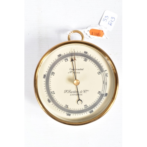 403 - A CASED COMPENSATED HANGING ANEROID BAROMETER, this is made of brass and has a white dial with black... 