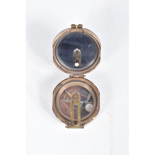 406 - TWO POCKET COMPASSES AND A FRAMED SILK, the first a powder coated 1940 T G Co Ltd London no. B 72269... 