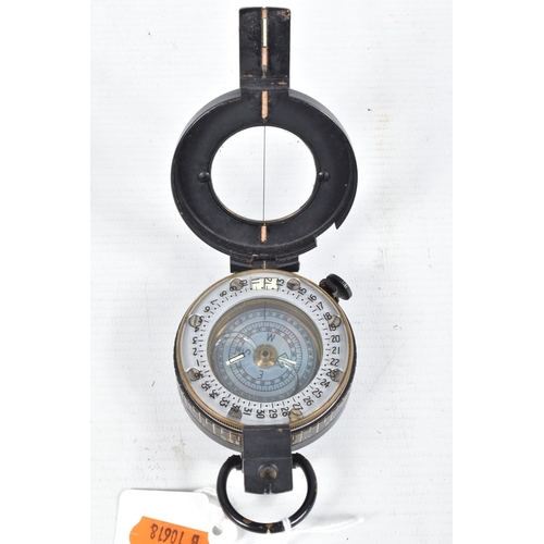 406 - TWO POCKET COMPASSES AND A FRAMED SILK, the first a powder coated 1940 T G Co Ltd London no. B 72269... 