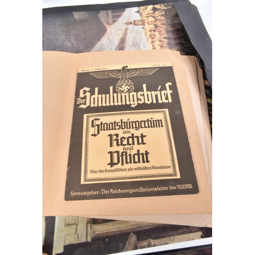 417 - A LARGE FOLDER CONTAINING A QUANTITY OF GERMAN POSTERS, magazines and newspapers, this includes edit... 