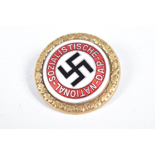 439 - A GERMAN NSDAP BADGE NUMBERED 5204, this features white, red and black enamel all with a garland on ... 