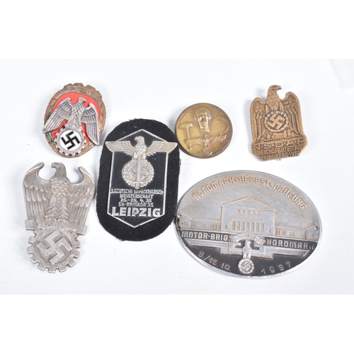 442 - A COLLECTION OF GERMAN BADGES AND A LEIPZIG SHIELD, the badges include a pioneer of labour pin badge... 