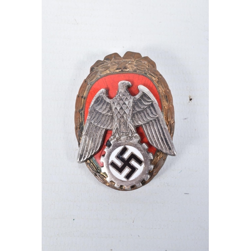 442 - A COLLECTION OF GERMAN BADGES AND A LEIPZIG SHIELD, the badges include a pioneer of labour pin badge... 