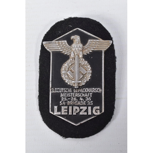 442 - A COLLECTION OF GERMAN BADGES AND A LEIPZIG SHIELD, the badges include a pioneer of labour pin badge... 