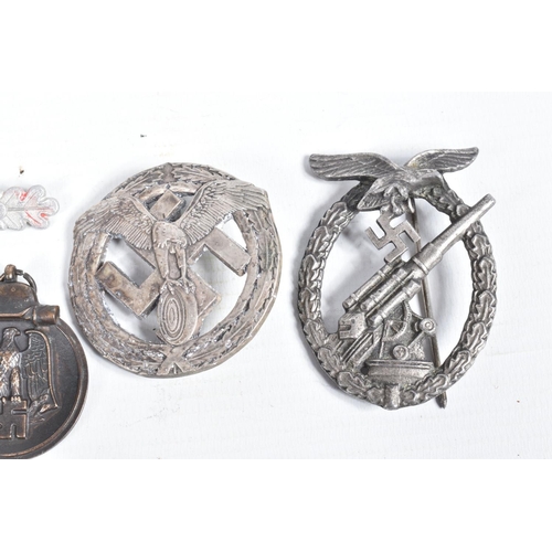 443 - A COLLECTION OF GERMAN BADGES, AWARDS AND EASTERN FRONT MEDAL, the awards include a Flak badge, make... 