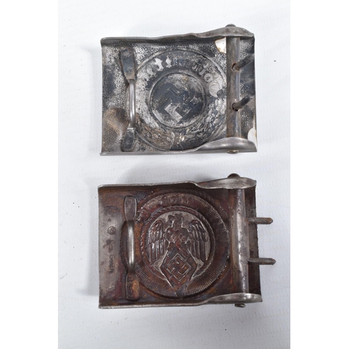 449 - THREE GERMAN BELT BUCKLES, to include a fire/police buckle with a hamemred finish to the front, a HJ... 