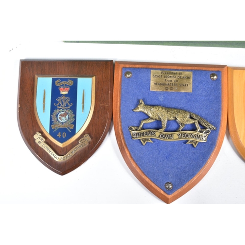 456 - A QUANTITY OF MILITARY WOODEN COMMEMORATIVE WALL PLAQUES, these include united nations, Northumberla... 