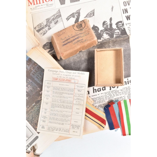 457 - A BOX SET OF WWII MEDALS AND TWO NEWSPAPERS, the medal come with their entitlement slip and was issu... 