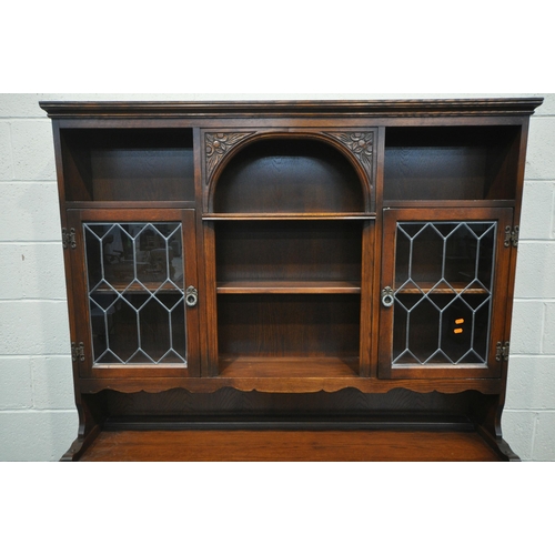 1203 - A 20TH CENTURY OAK OLD CHARM DRESSER, the top fitted with two lead glazed doors and an arrangement o... 