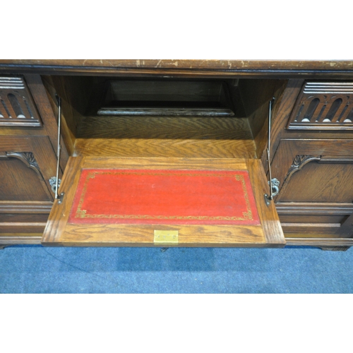 1203 - A 20TH CENTURY OAK OLD CHARM DRESSER, the top fitted with two lead glazed doors and an arrangement o... 