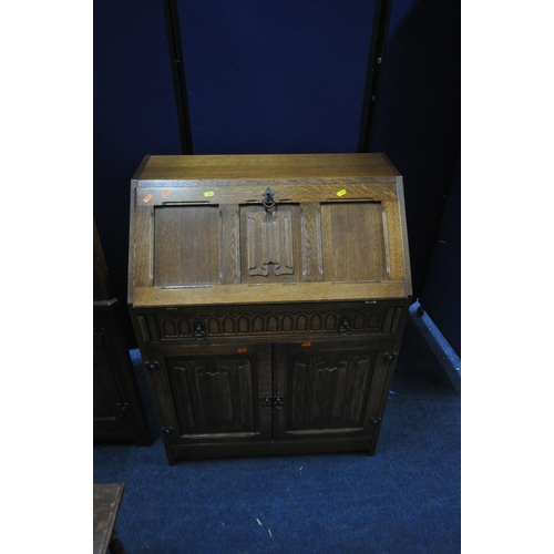 1204 - A SELECTION OF 20TH CENTURY OAK FURNITURE, to include an Old Charm corner cupboard, with double lead... 