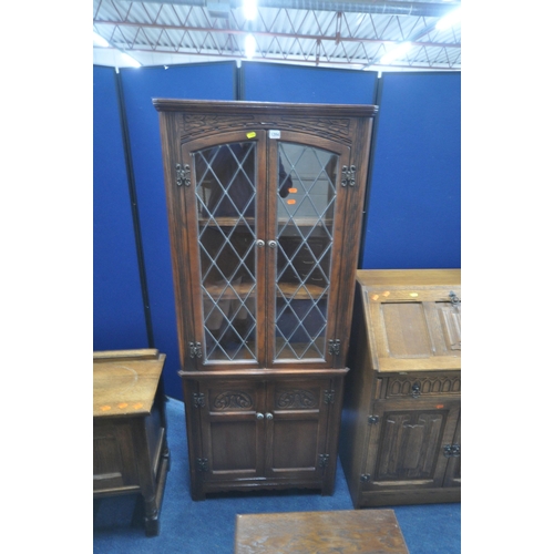 1204 - A SELECTION OF 20TH CENTURY OAK FURNITURE, to include an Old Charm corner cupboard, with double lead... 