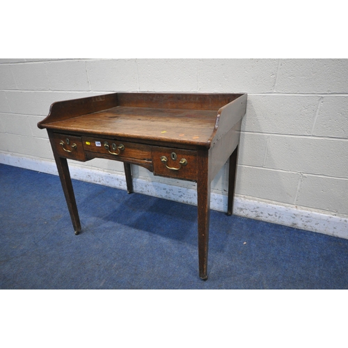 1209 - A LATE 19TH / EARLY 20TH CENTURY OAK SIDE TABLE, with a raised gallery back, three frieze drawers, o... 