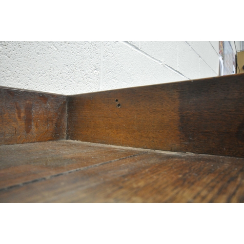 1209 - A LATE 19TH / EARLY 20TH CENTURY OAK SIDE TABLE, with a raised gallery back, three frieze drawers, o... 