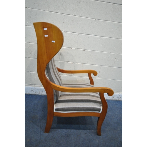 1213 - A WALNUT FRAMED WING BACK ARMCHAIR, with scrolled open armrests, with stripped upholstery, width 62c... 