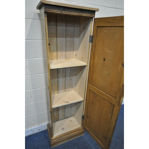 1214 - A 20TH CENTURY SLIM PINE SINGLE DOOR CUPBOARD, with two fixed shelves, width 57cm x depth 36cm x hei... 