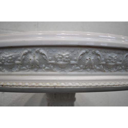 1219 - A CONTINENTAL MARBLE TOP CIRCULAR SIDE TABLE, raised on a moulded resin Corinthian style support dep... 