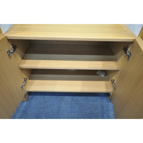 1224 - A SOLID LIGHT OAK SIDE TABLE, with a glass top, above two cupboard doors, width 90cm x depth 42cm x ... 