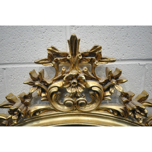 1225 - A GILT RESIN WALL MIRROR, with a flamboyant open foliate frame, 122cm x 116cm (condition report: ove... 