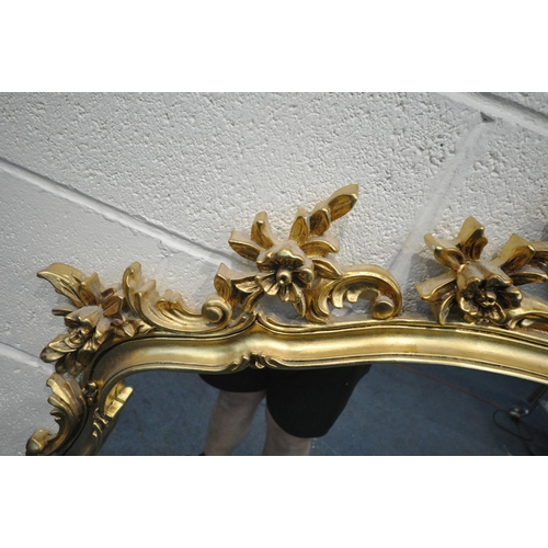 1225 - A GILT RESIN WALL MIRROR, with a flamboyant open foliate frame, 122cm x 116cm (condition report: ove... 