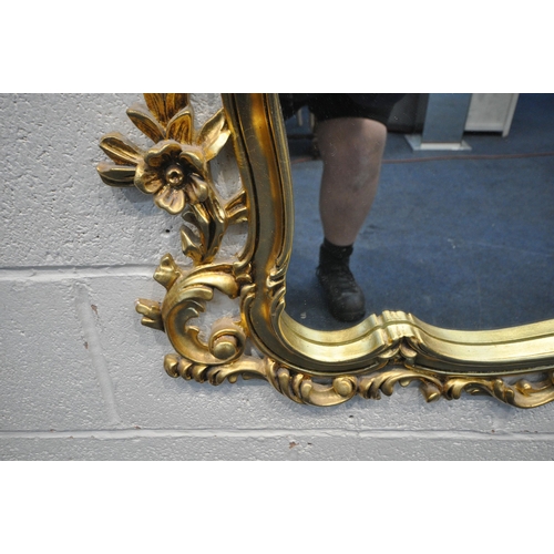 1225 - A GILT RESIN WALL MIRROR, with a flamboyant open foliate frame, 122cm x 116cm (condition report: ove... 