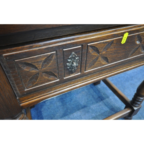 1230 - A 20TH CENTURY OAK JAYCEE BOOKCASE, with double lead glazed doors above double linenfold doors, widt... 