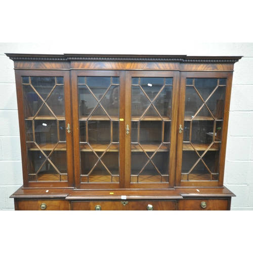 1238 - A REPRODUCTION MAHOGANY BREAKFRONT SECRETAIRE BOOKCASE, the top section fitted with four astragal gl... 