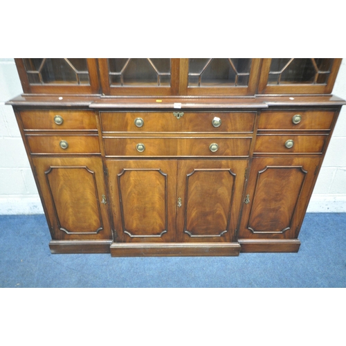 1238 - A REPRODUCTION MAHOGANY BREAKFRONT SECRETAIRE BOOKCASE, the top section fitted with four astragal gl... 