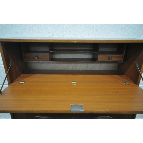 1245 - A MID CENTURY TEAK BUREAU, the fall front door enclosing a fitted interior, above three drawers and ... 