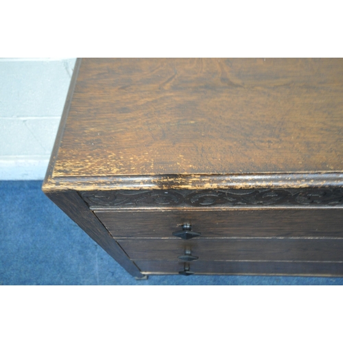 1252 - A 20TH CENTURY OAK CHEST OF THREE LONG DRAWERS, with a raised back, on turned and block legs, width ... 