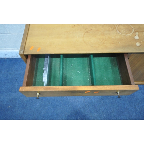 1309 - A MID CENTURY YOUNGER TEAK SIDEBOARD, fitted with four drawers, double cupboard doors, on square tap... 