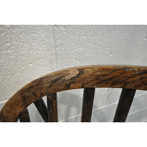 1323 - A NEAR PAIR OF 19TH CENTURY ELM FARMHOUSE STYLE WINDSOR ARMCHAIRS, with spindle back, turned support... 