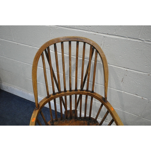 1324 - A NEAR PAIR OF 19TH CENTURY ELM FARMHOUSE STYLE WINDSOR ARMCHAIRS, with spindle back, turned support... 