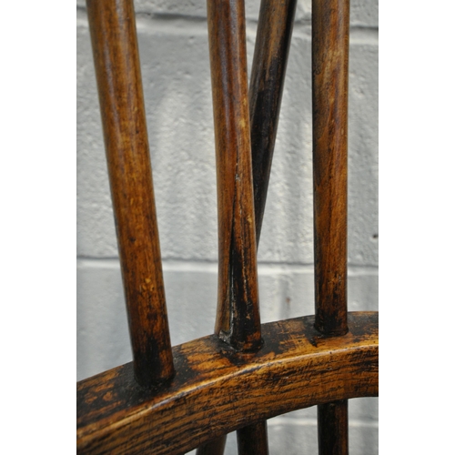 1324 - A NEAR PAIR OF 19TH CENTURY ELM FARMHOUSE STYLE WINDSOR ARMCHAIRS, with spindle back, turned support... 