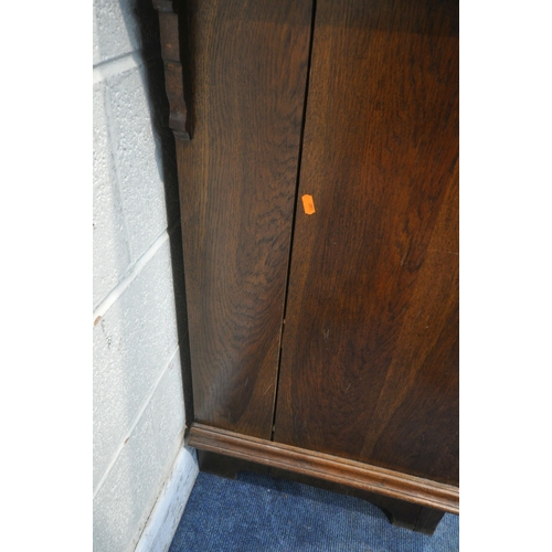 1325 - A 20TH CENTURY OAK BOOKCASE, the double glazed doors enclosing three shelves, above two drawers and ... 