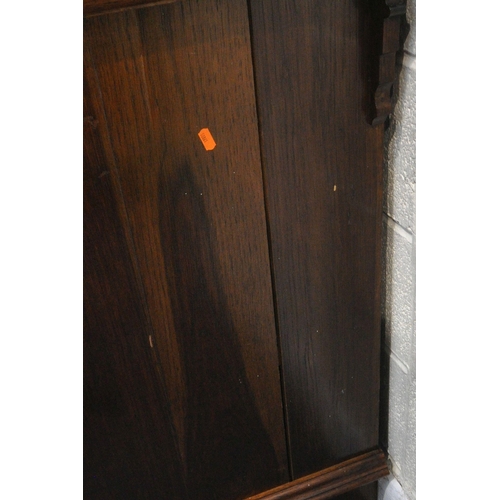 1325 - A 20TH CENTURY OAK BOOKCASE, the double glazed doors enclosing three shelves, above two drawers and ... 