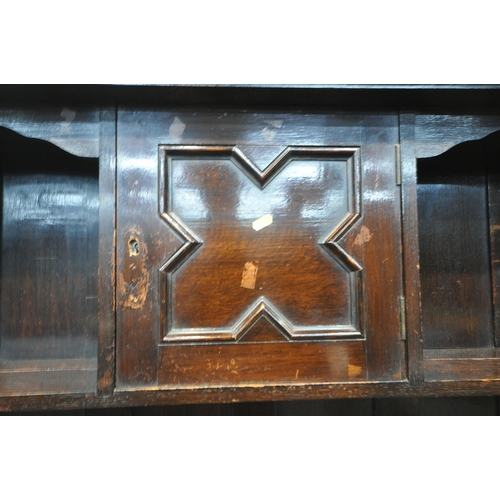 1326 - A 20TH CENTURY OAK DRESSER, the top with a single door and an arrangement of shelving, the base fitt... 