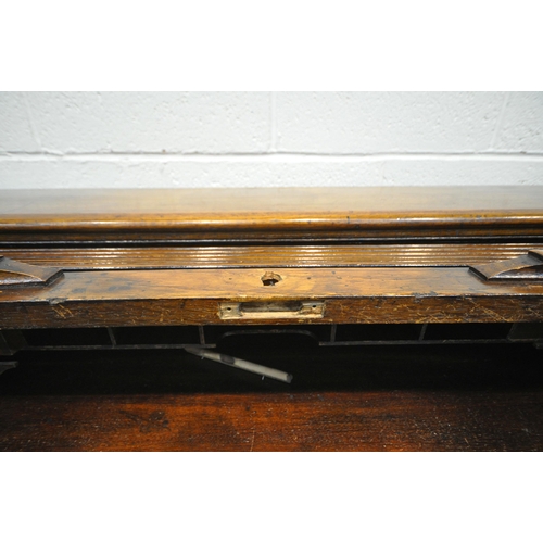 1328 - A 20TH CENTURY OAK ROLL TOP DESK, with a fitted interior, above an arrangement of five drawers and t... 