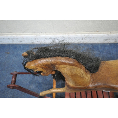 1330 - A HANDMADE HARDWOOD ROCKING HORSE, with real horse hair, on a stained bow frame, length 120cm x heig... 