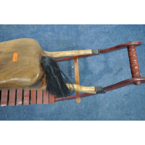 1330 - A HANDMADE HARDWOOD ROCKING HORSE, with real horse hair, on a stained bow frame, length 120cm x heig... 