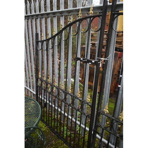 1003 - A PAIR OF WROUGHT IRON DRIVEWAY GATES, arched top, with gilt finials, overall width 454cm x each gat... 