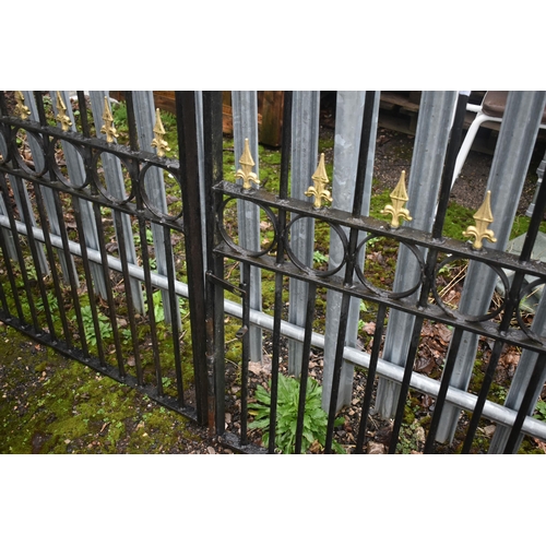 1003 - A PAIR OF WROUGHT IRON DRIVEWAY GATES, arched top, with gilt finials, overall width 454cm x each gat... 