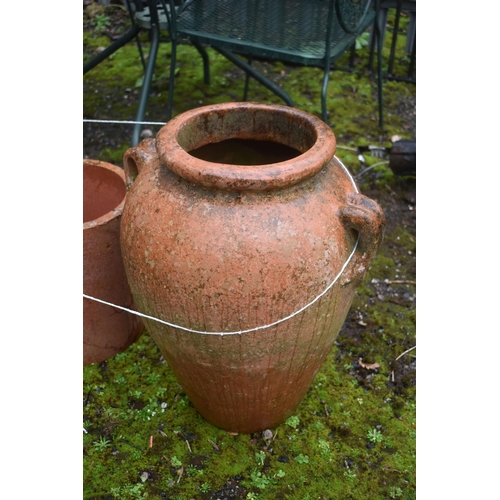 1006 - A TERRACOTTA URN SHAPED GARDEN PLANTER, height 51cm, along with two terracotta circular planters, a ... 