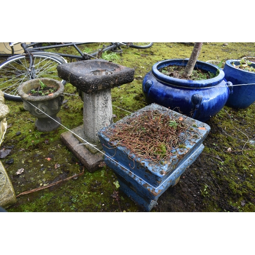 1009 - A WEATHERED COMPOSITE BIRD BATH, height 46cm, along with a pair of small garden urns, diameter 26cm ... 