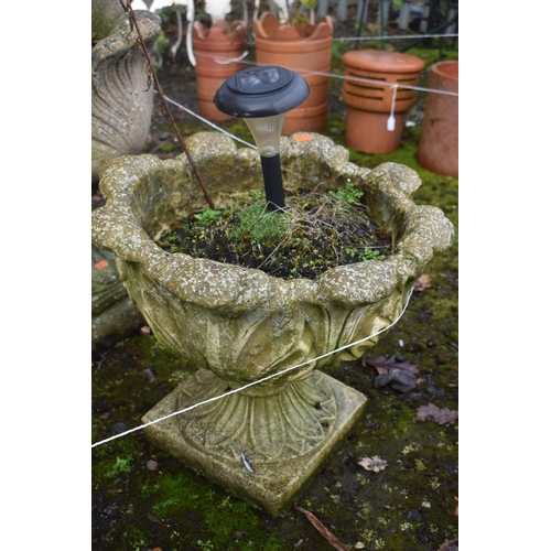 1010 - THREE SIMILAR WEATHERED ACANTHUS LEAF SHAPED CIRCULAR PLANTERS, largest planter diameter 50cm x heig... 